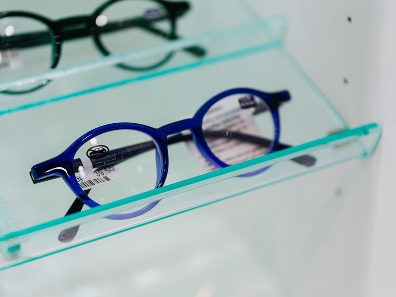 Modern eyeglasses showcased in an eyewear display case